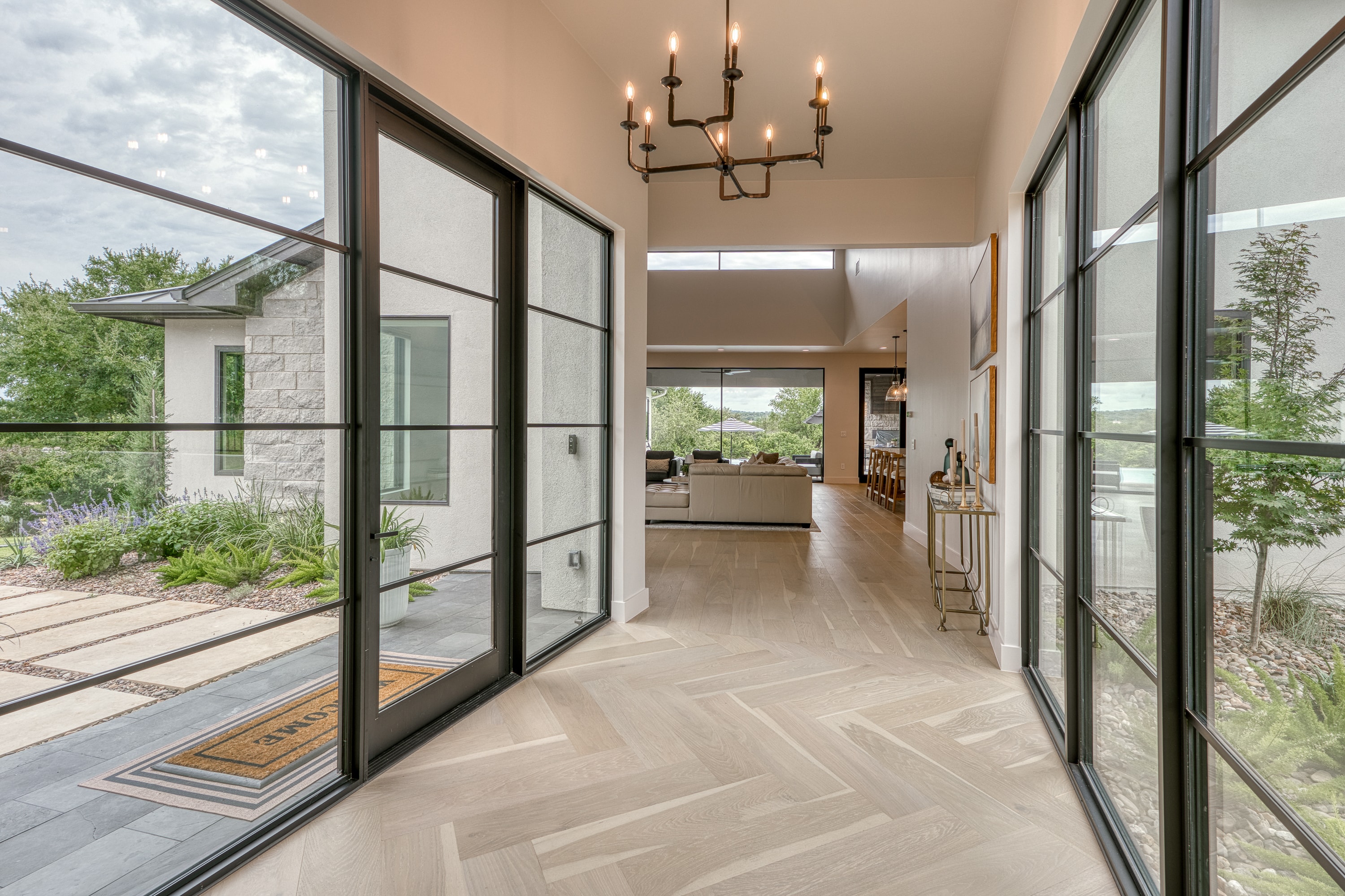 Luxury home interior with foyer and Hill Country views