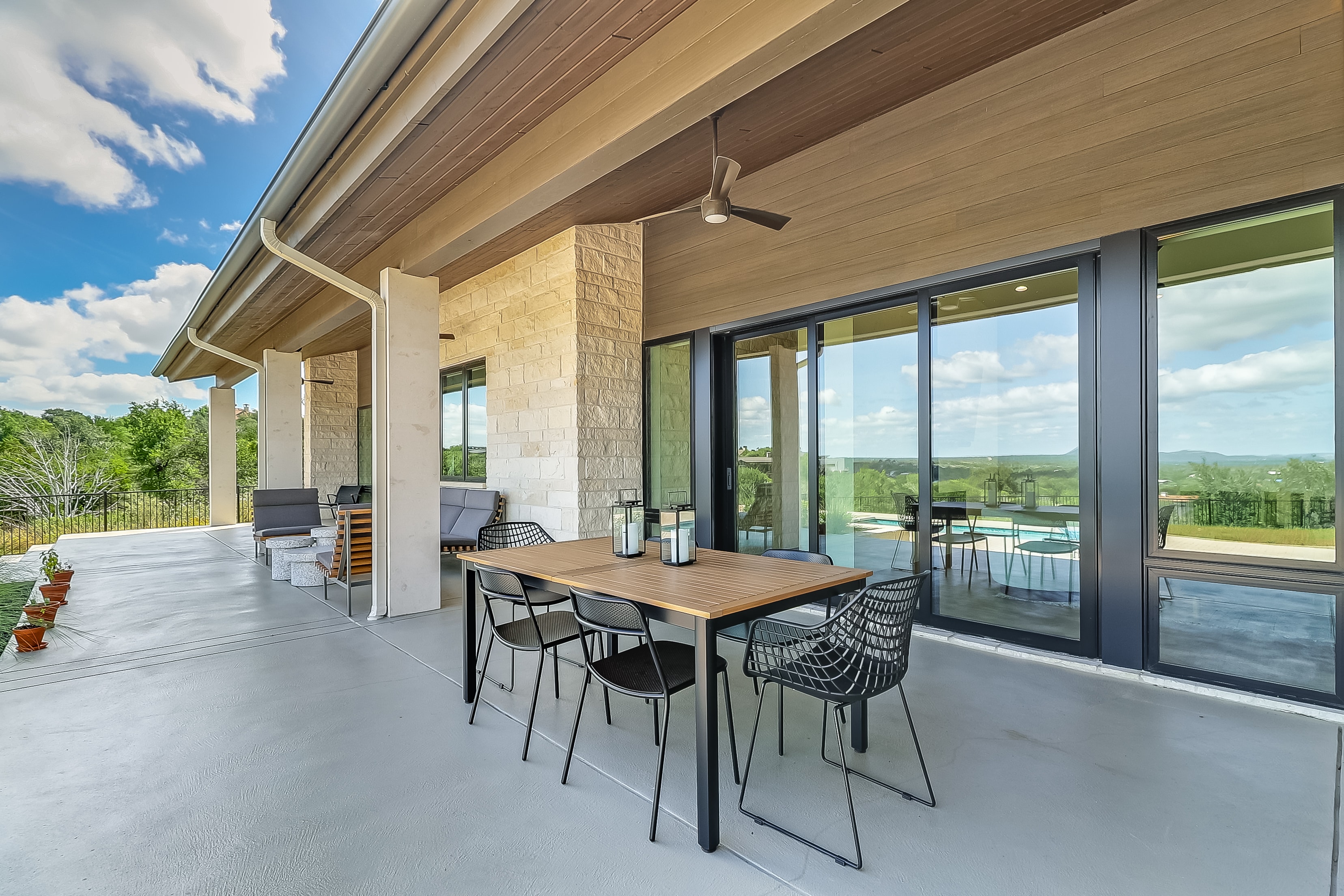 Covered outdoor living with Hill Country views and pool, The Architect's View